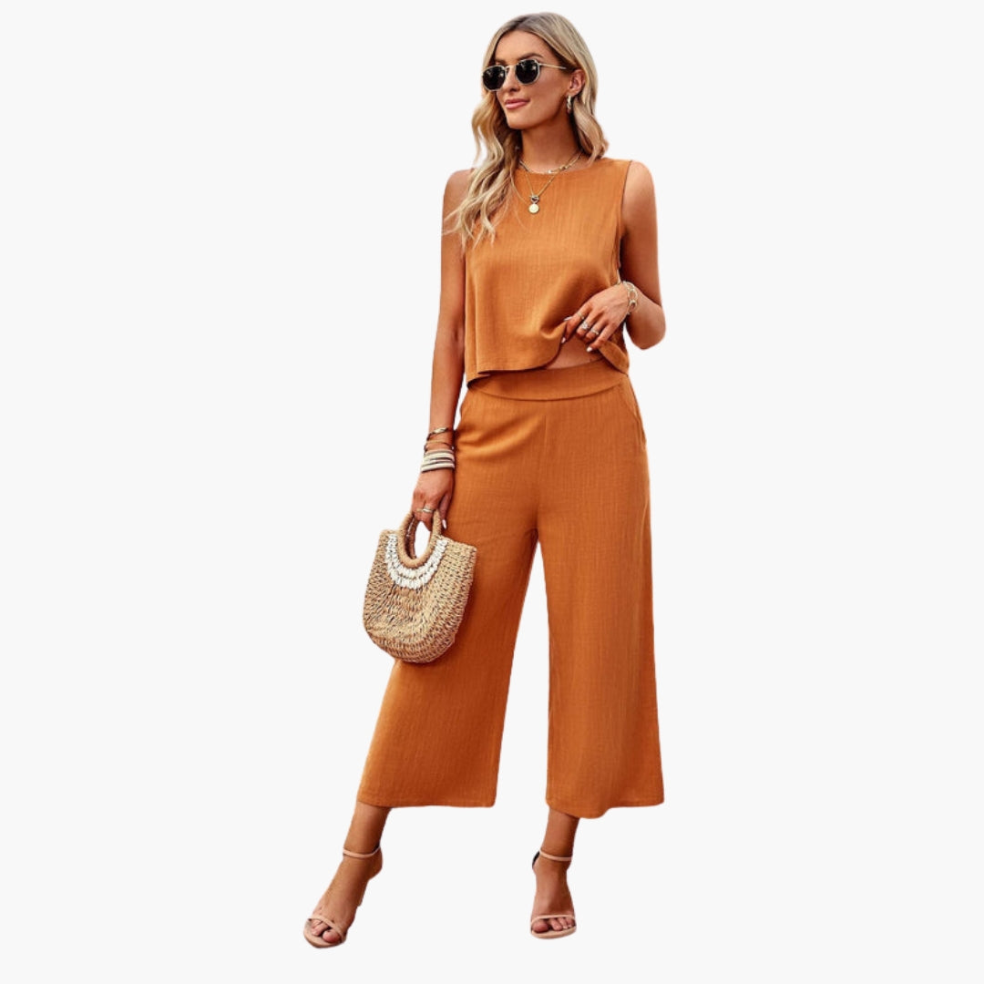 Tuta donna con scollo rotondo e tasche laterali