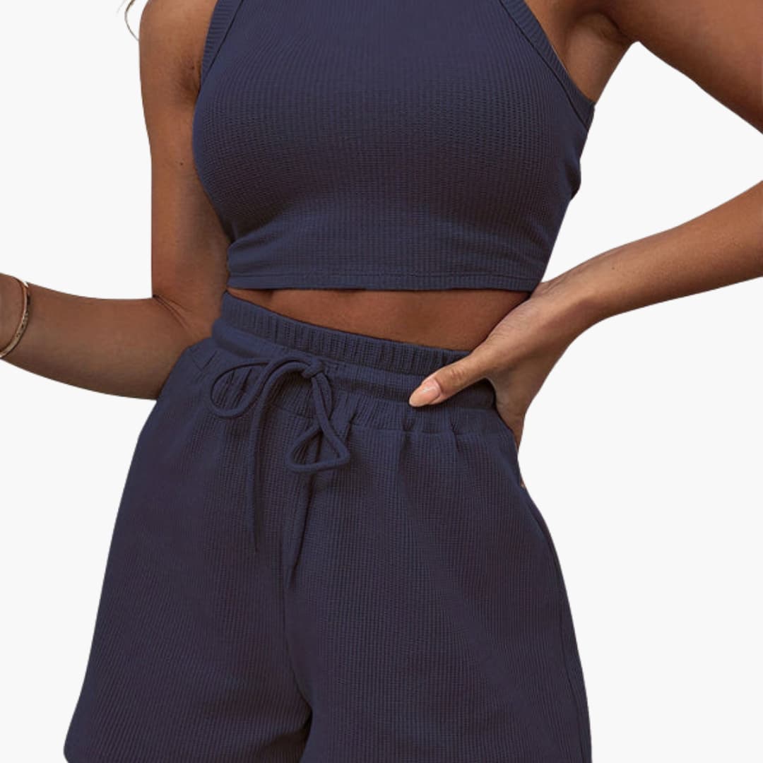 Completo sportivo donna con top a schiena scoperta e pantaloncini