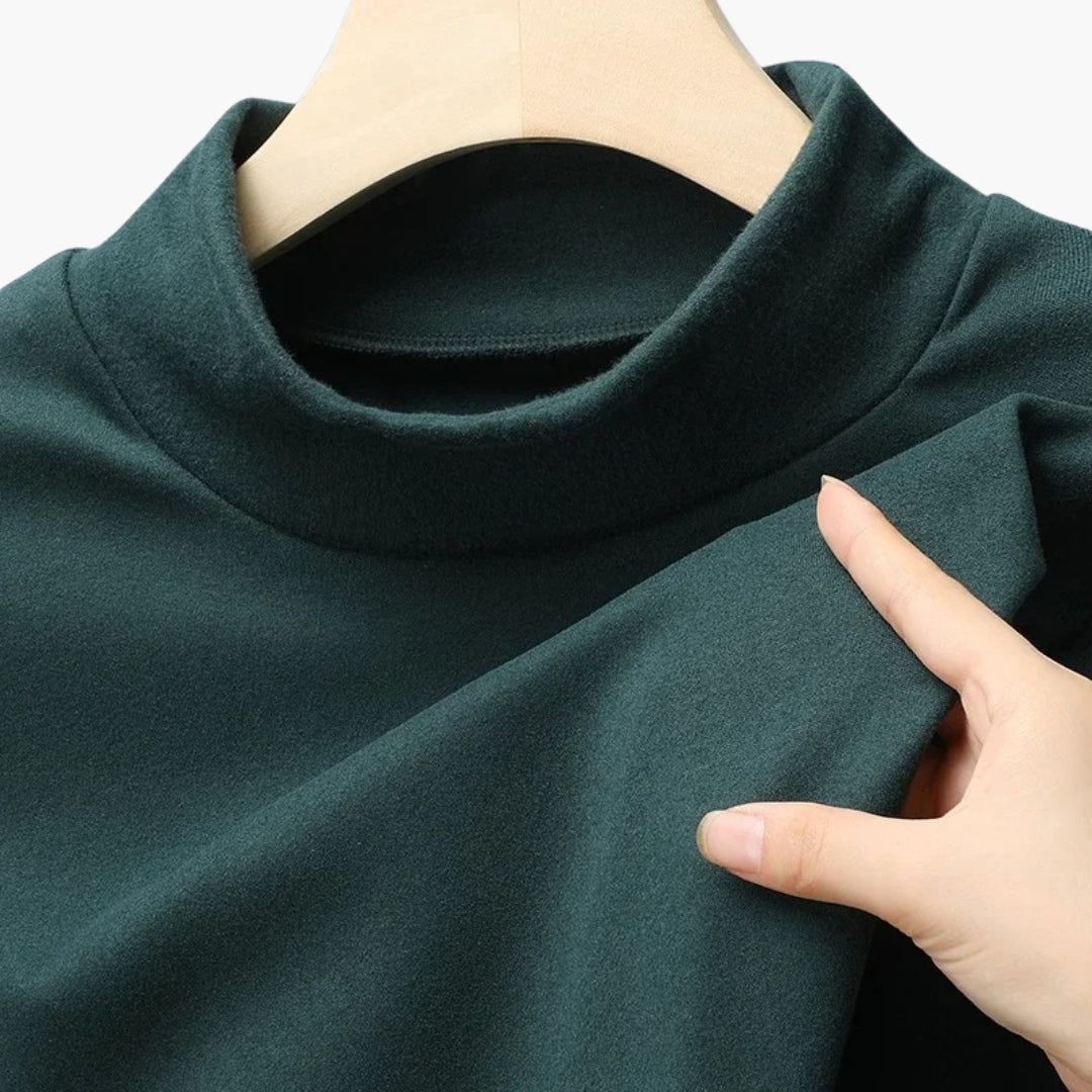 Damebluse med høj hals og lange ærmer
