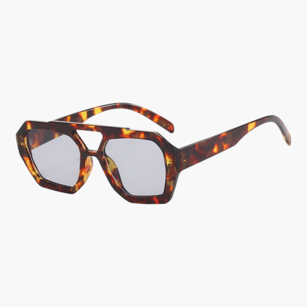 Lunettes de soleil femmes avec monture géométrique et verres teintés