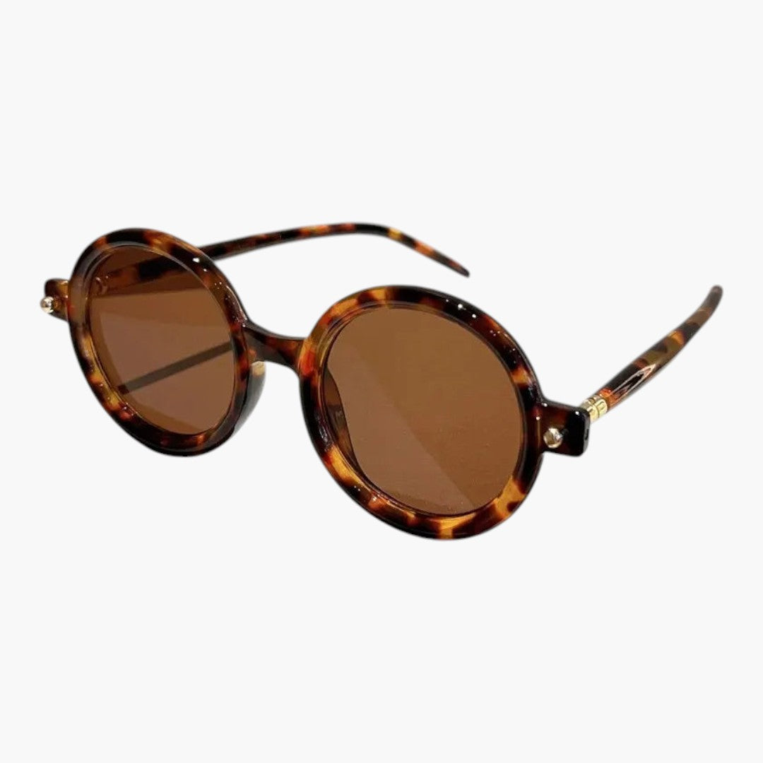 Women's sunglasses with round frame and wide temples