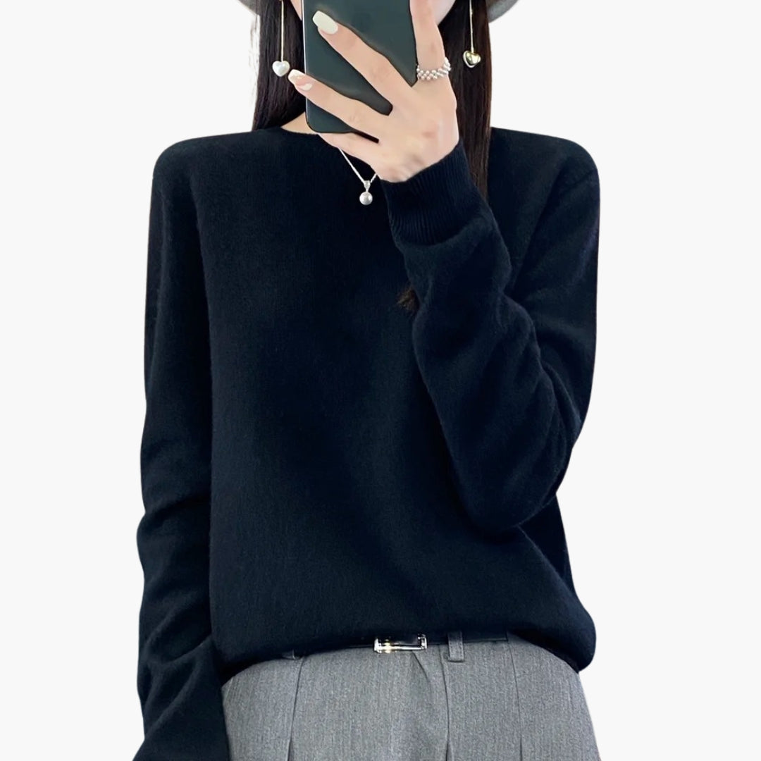 Dame striktrøje med rund hals og ribstrikkede manchetter