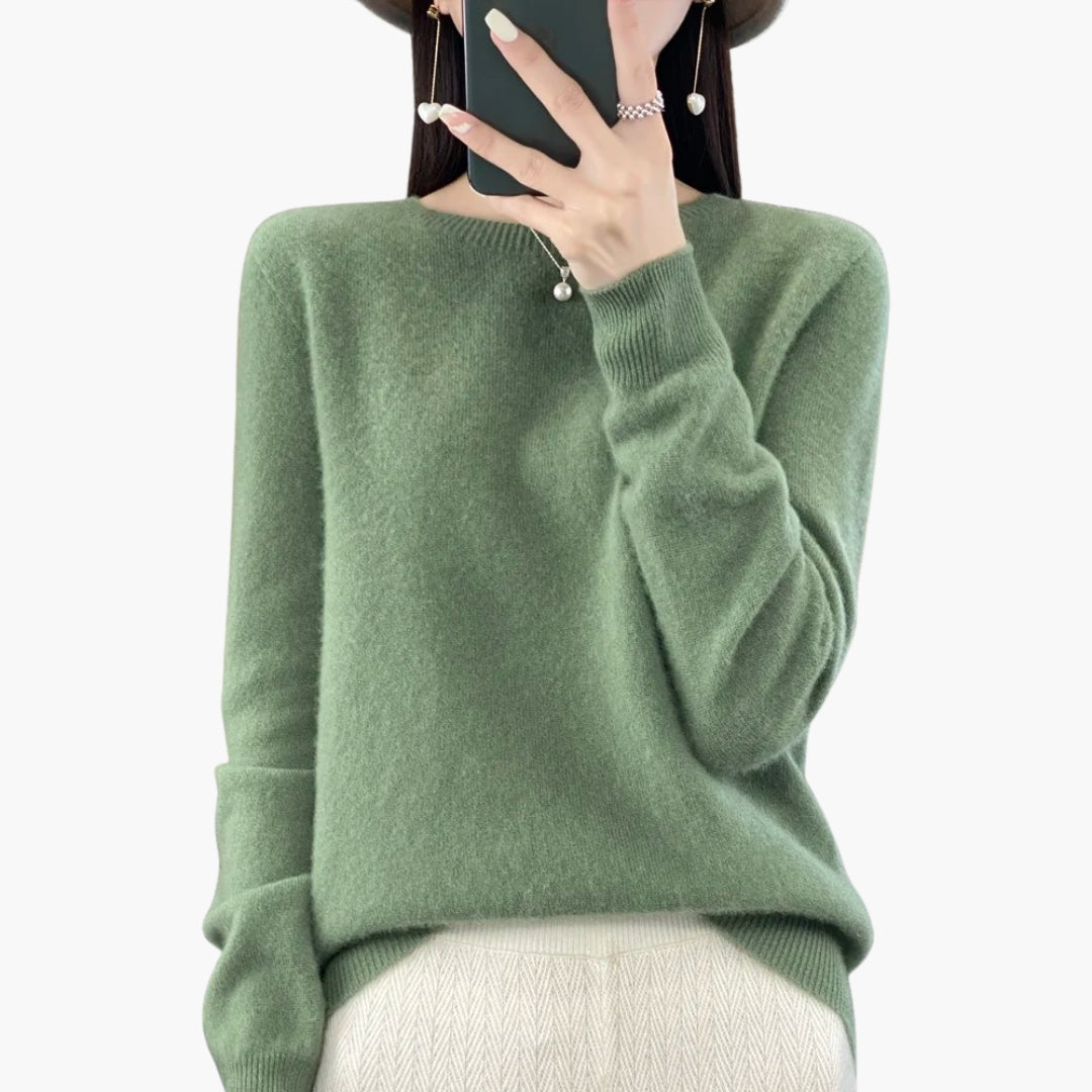 Dame striktrøje med rund hals og ribstrikkede manchetter