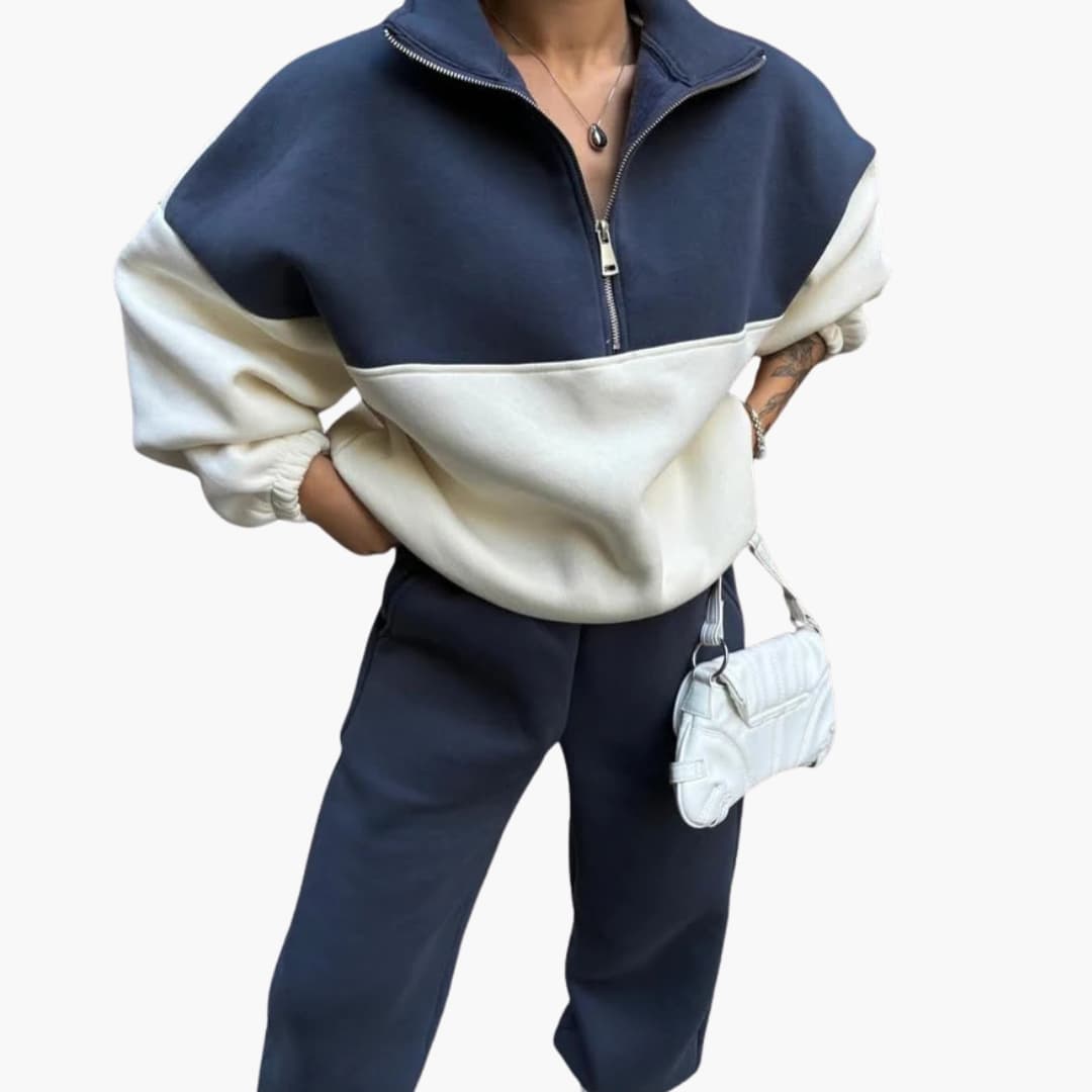 Pull bicolor para mulher com meio fecho e ombros caídos