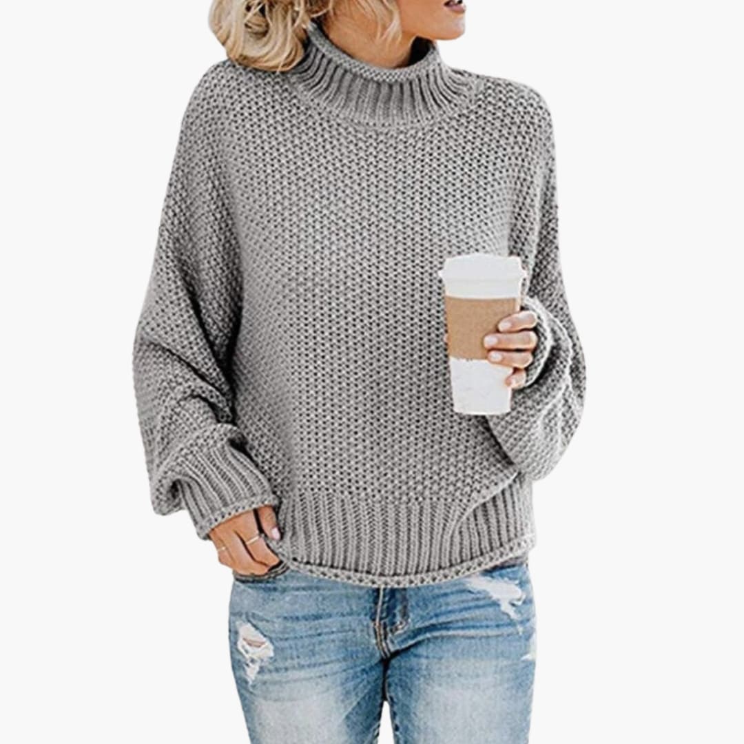 Pull de malha para mulher com gola alta e superfície texturizada