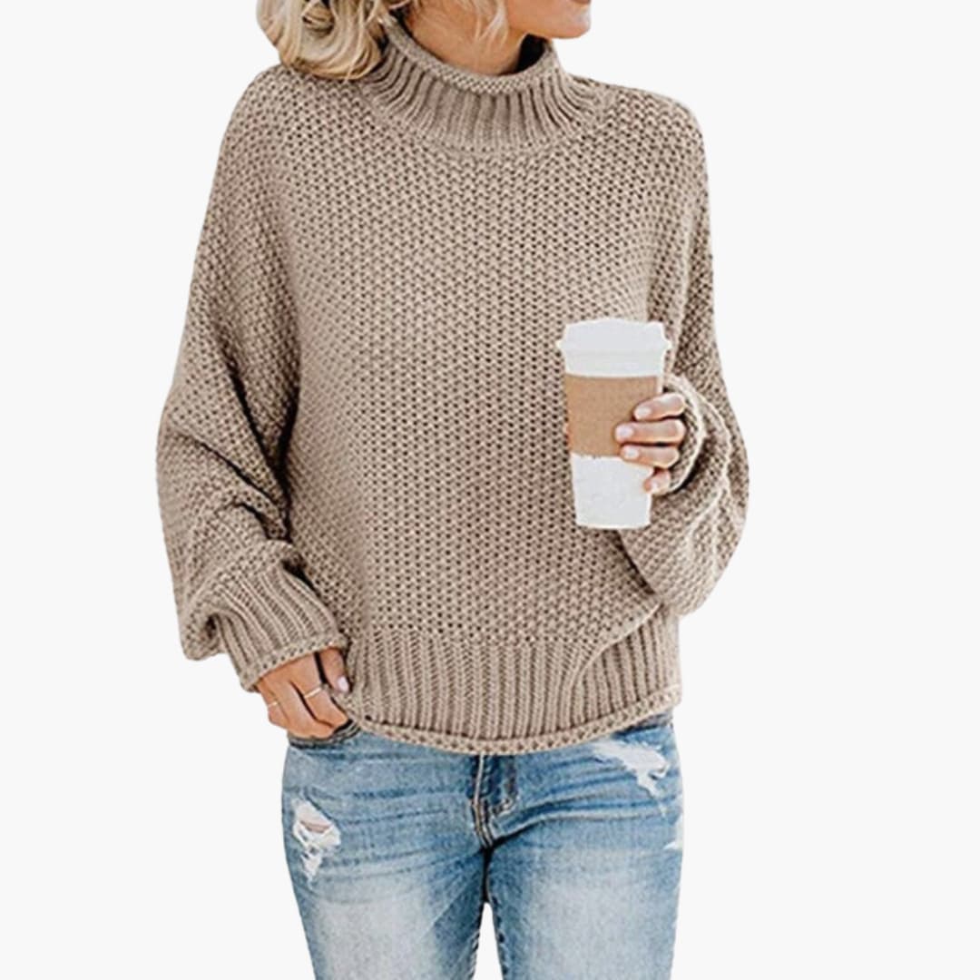 Pull femme avec col montant et surface côtelée