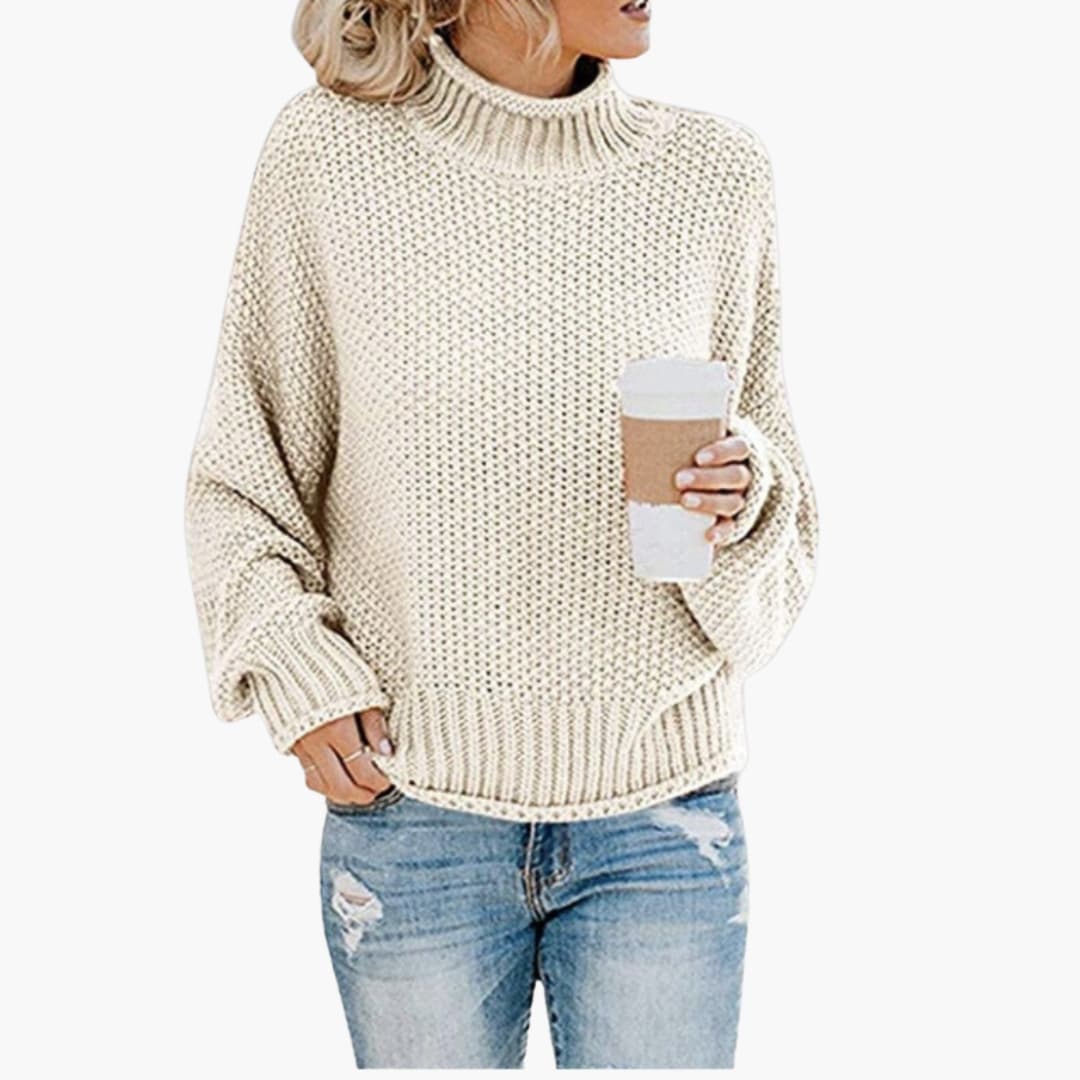 Pull femme avec col montant et surface côtelée