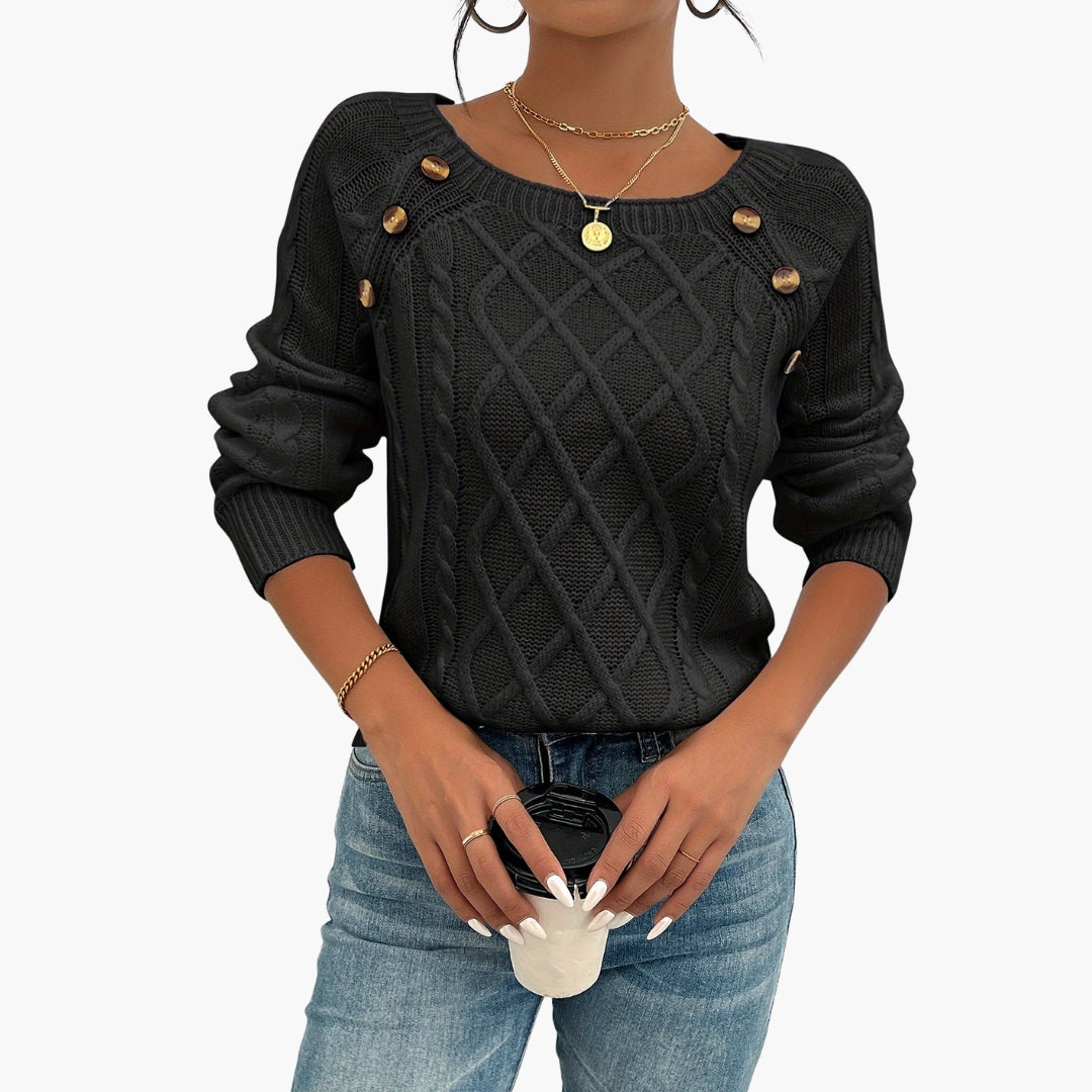 Damegenser i vridd strikk med rund hals og knappedetalj