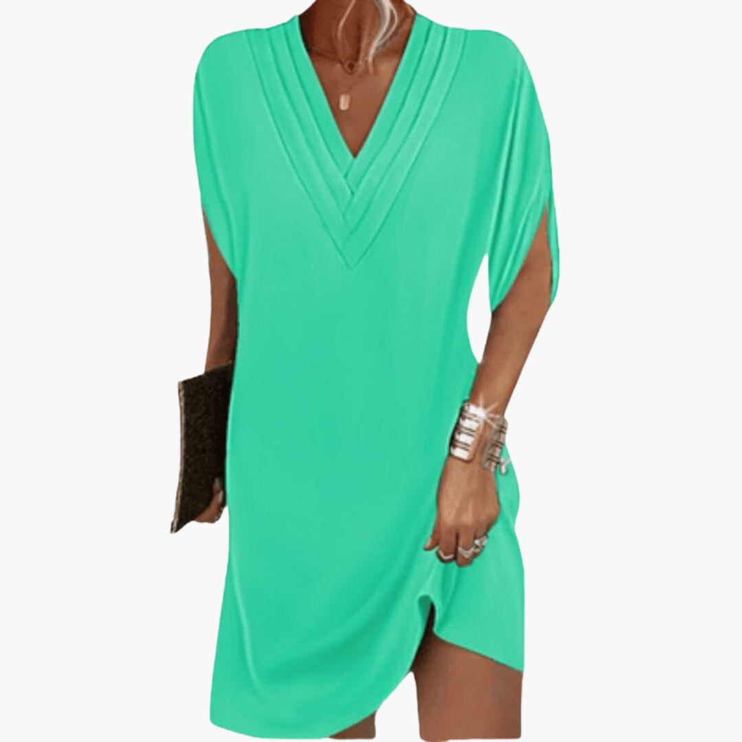 Short women's dress with V-neck and draped hem