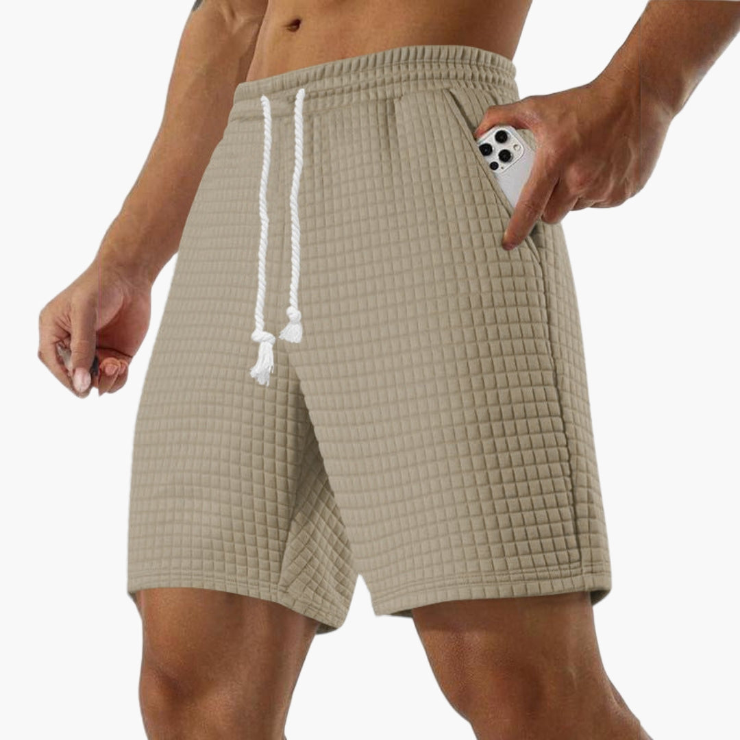 Kort sportshorts for menn med elastisk midje