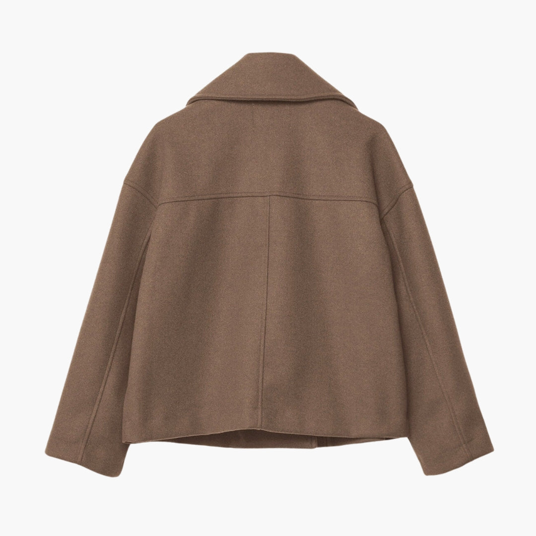 Kort damevest med krydset lukning