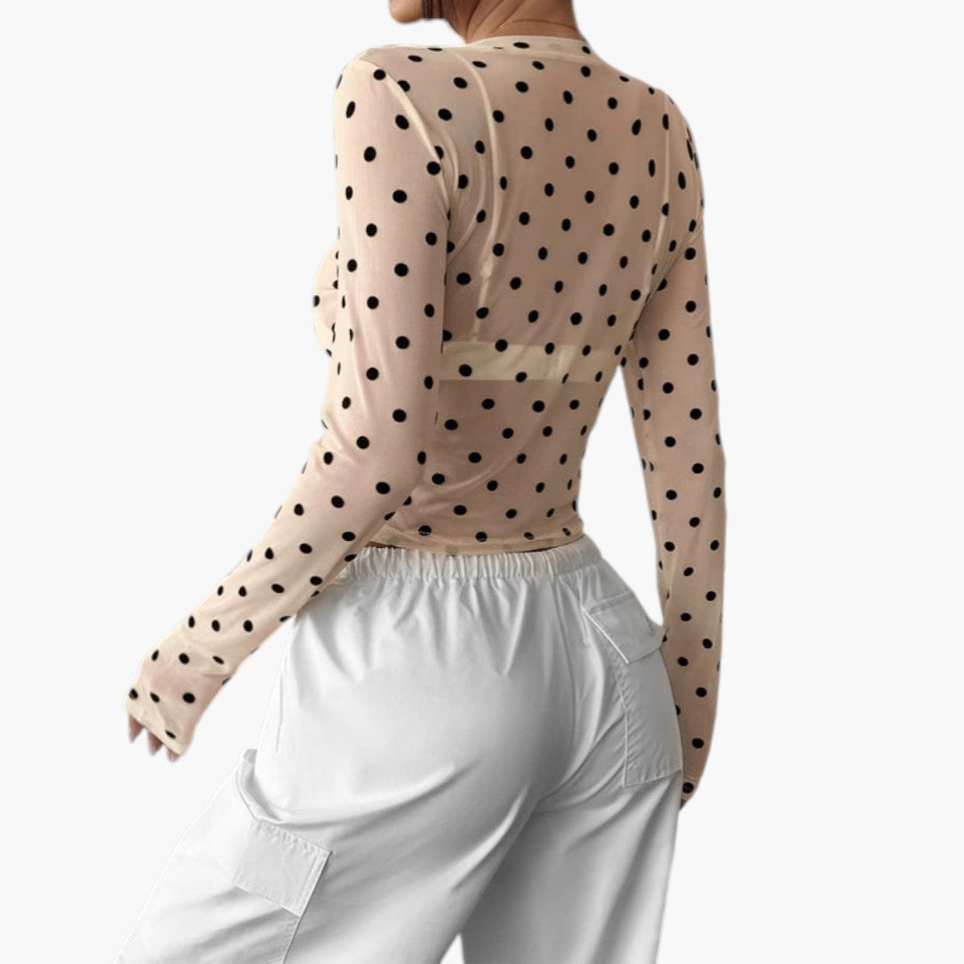 Women's blouse with round neckline and polka dot pattern