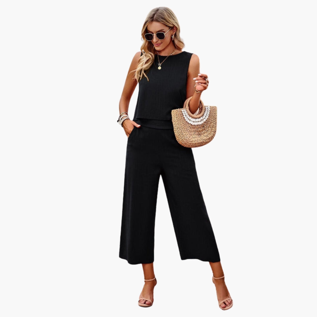 Tuta donna con scollo rotondo e tasche laterali
