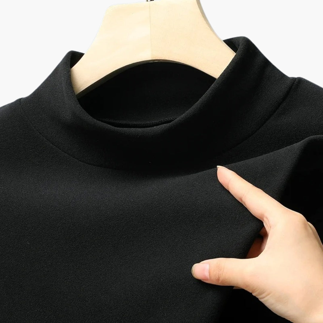 Damebluse med høj hals og lange ærmer