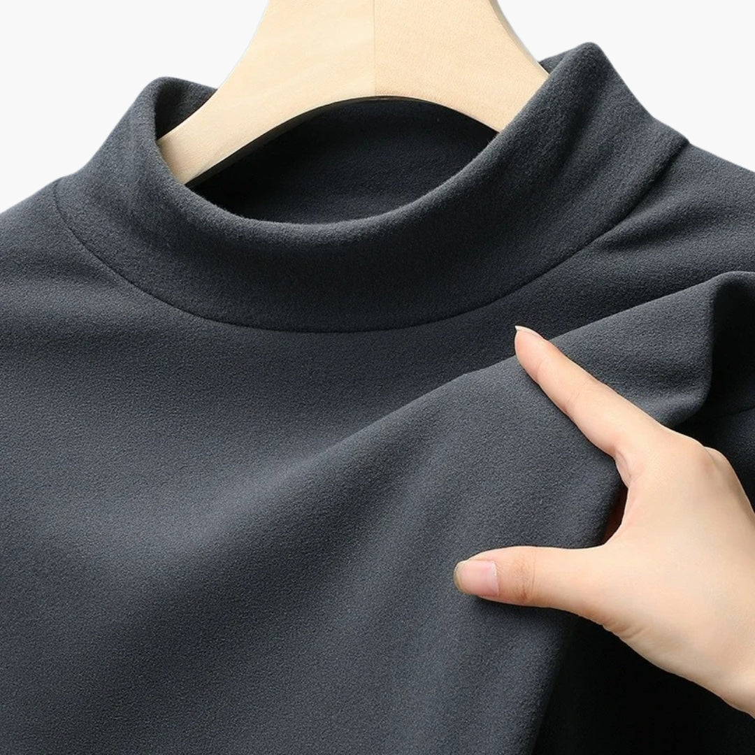 Damebluse med høj hals og lange ærmer