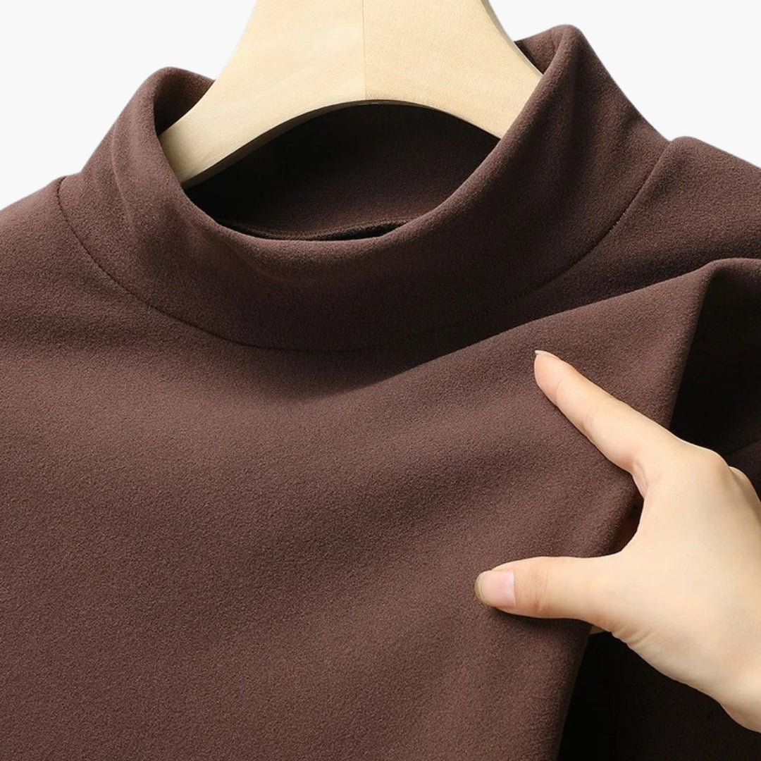 Damebluse med høj hals og lange ærmer