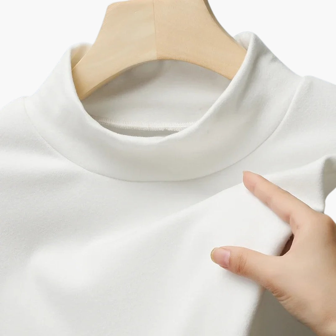Damebluse med høj hals og lange ærmer