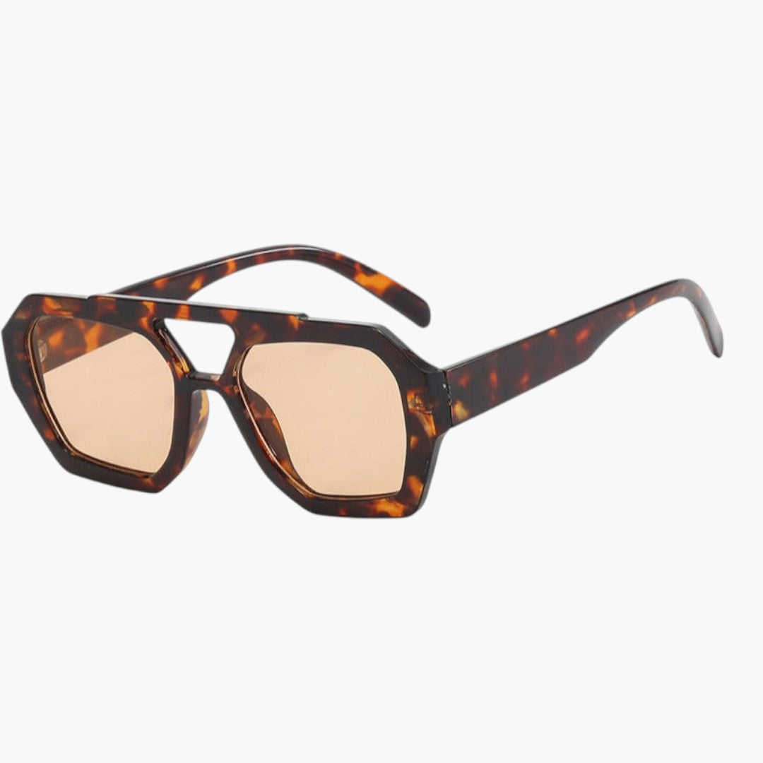 Lunettes de soleil femmes avec monture géométrique et verres teintés