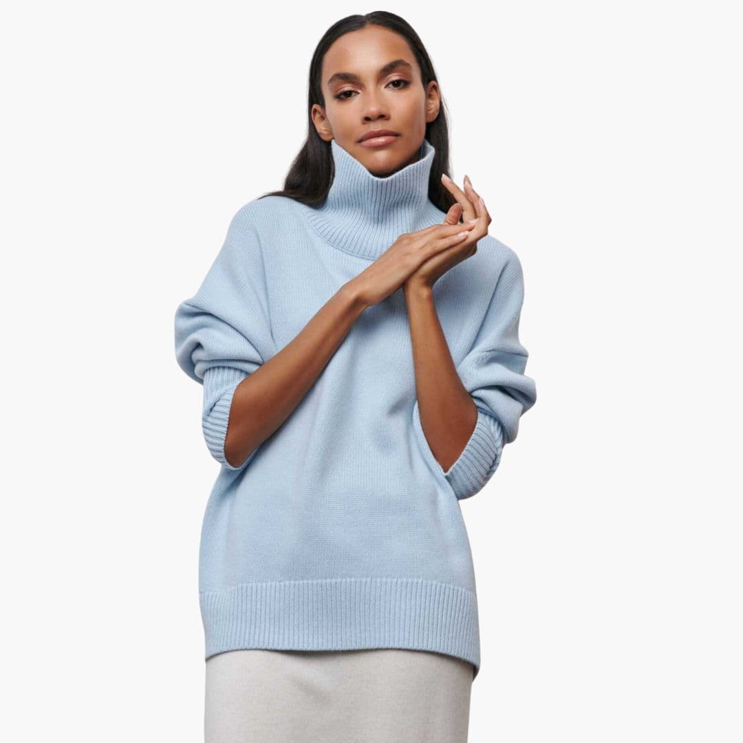 Suéter de mujer de punto con cuello alto y bajos acanalados