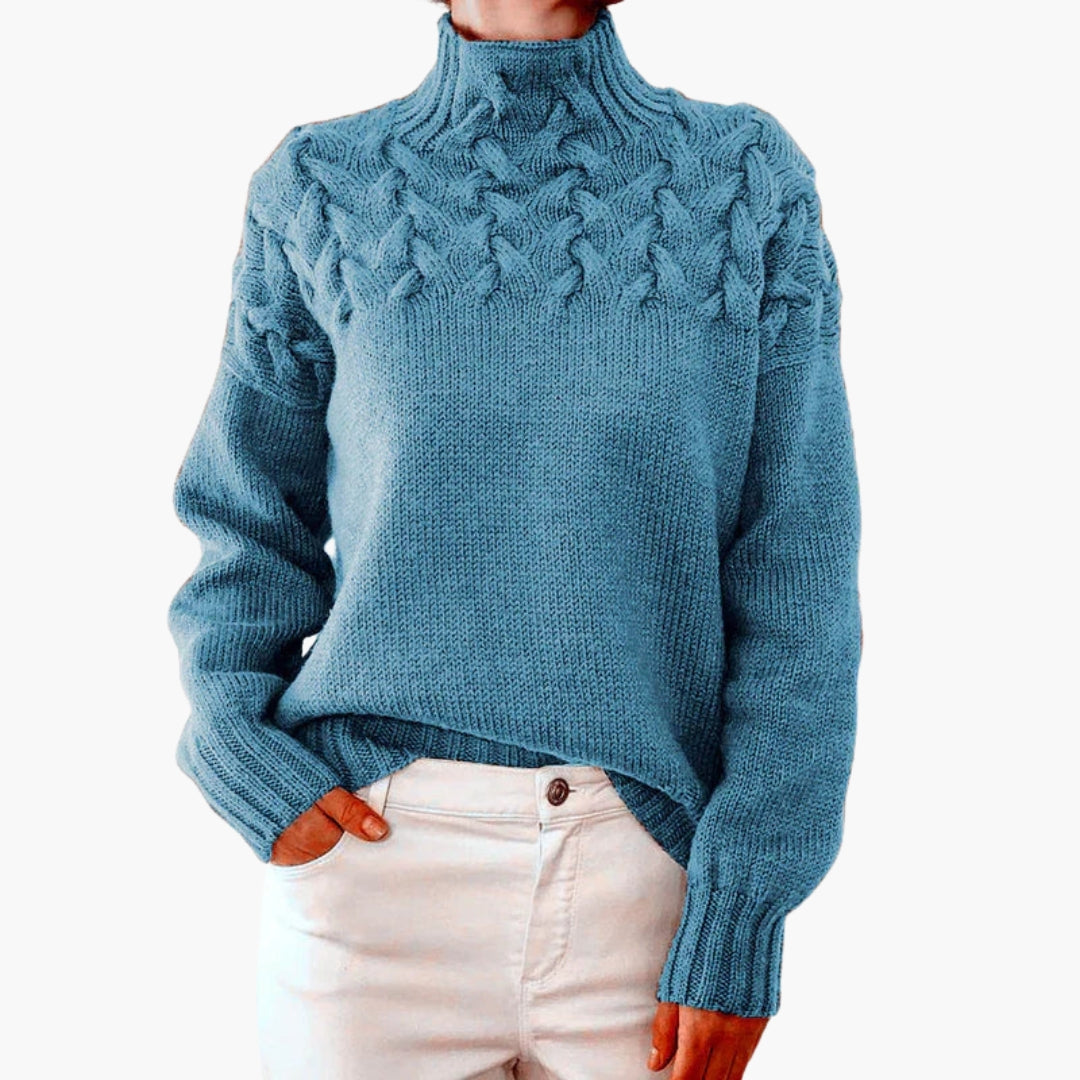 Pull femme à col montant et maille torsadée