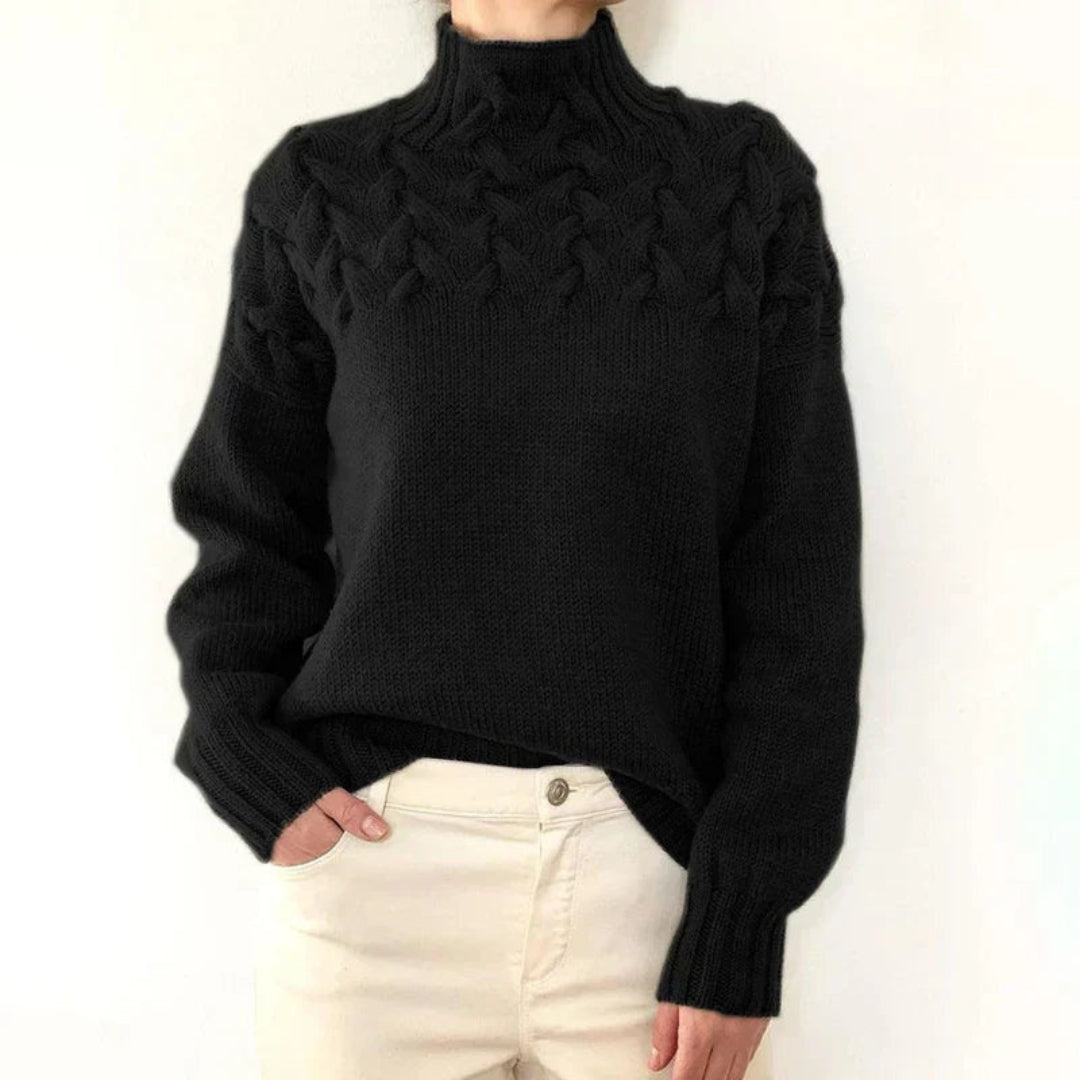 Pull femme à col montant et maille torsadée