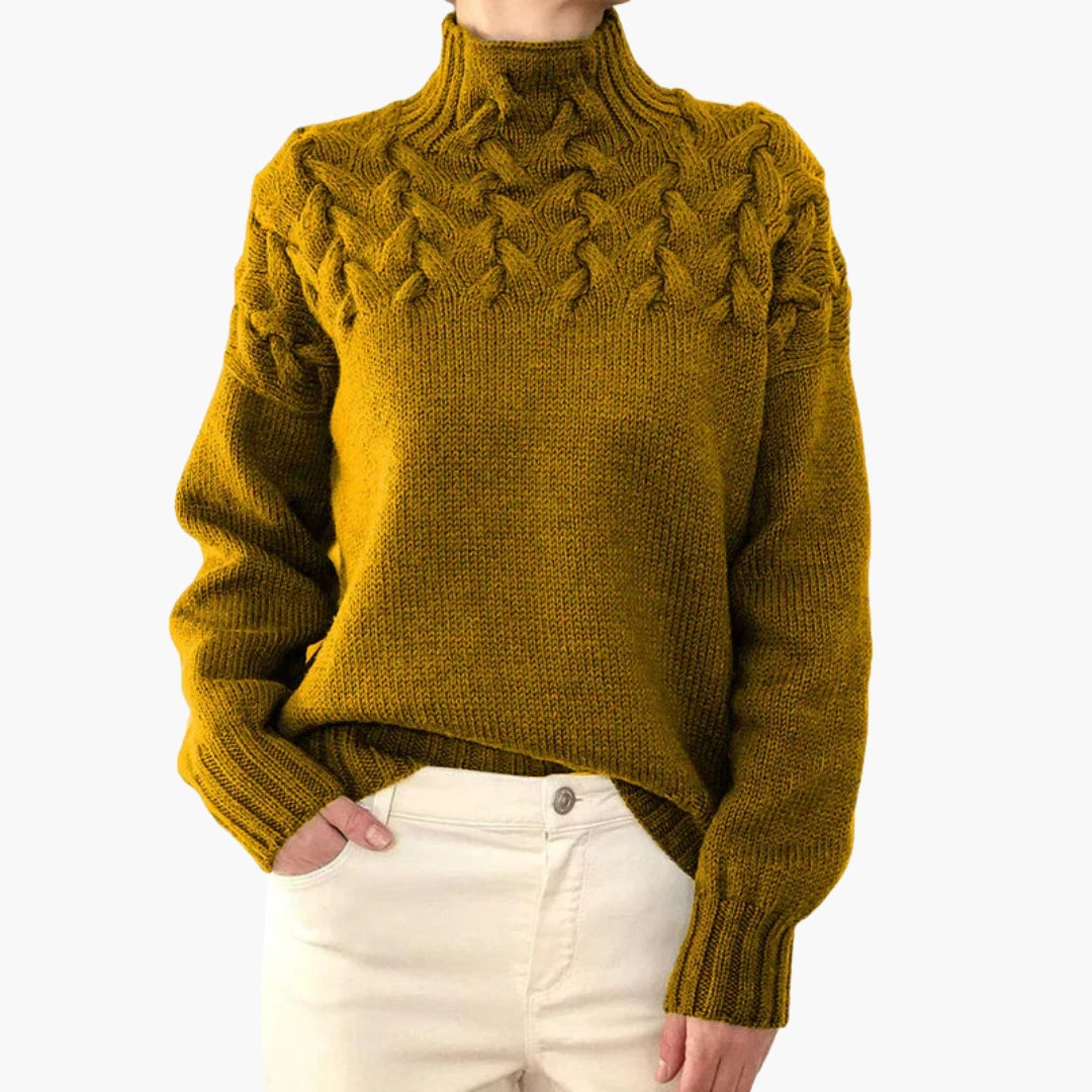 Pull femme à col montant et maille torsadée