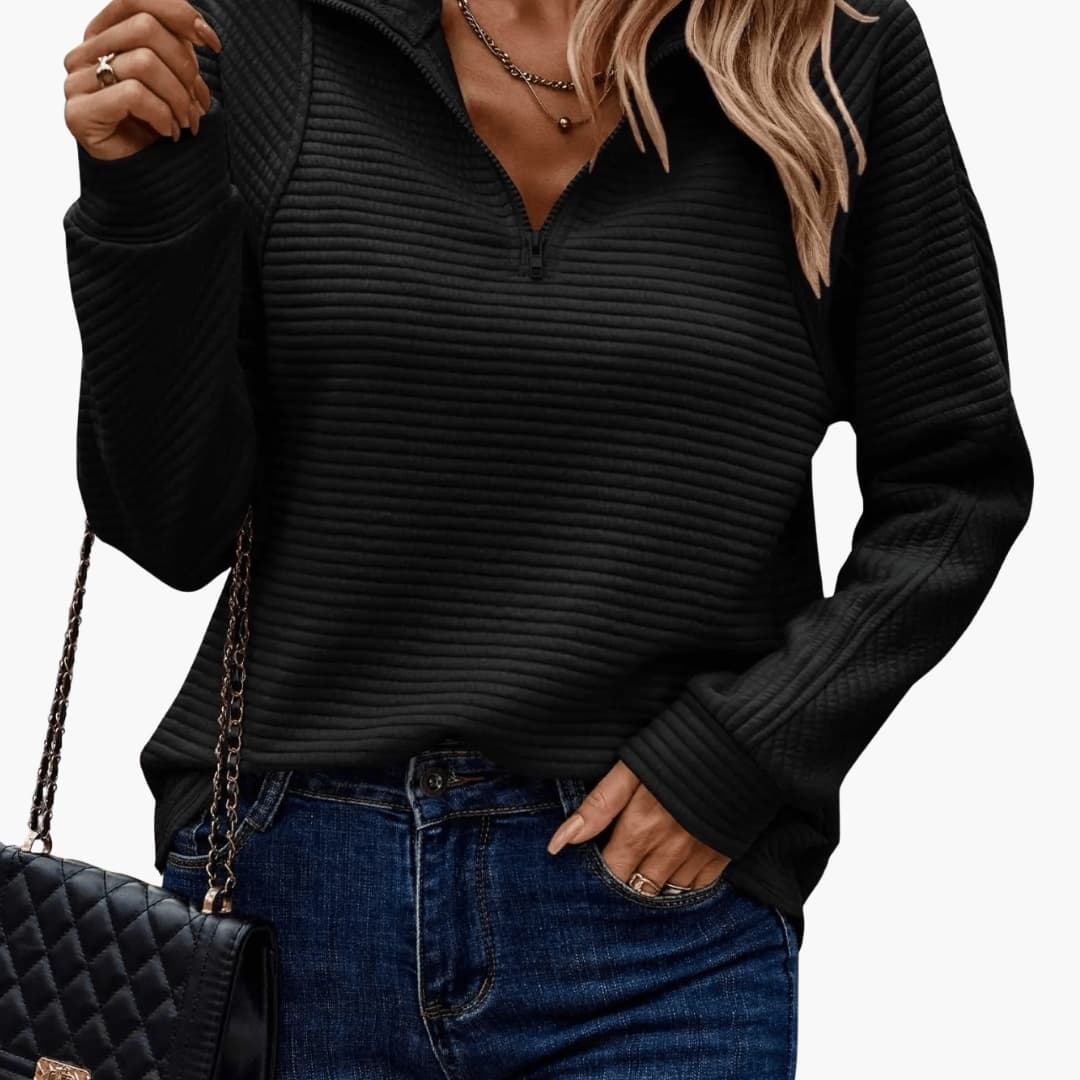 Pull femme à col zippé avec surface côtelée