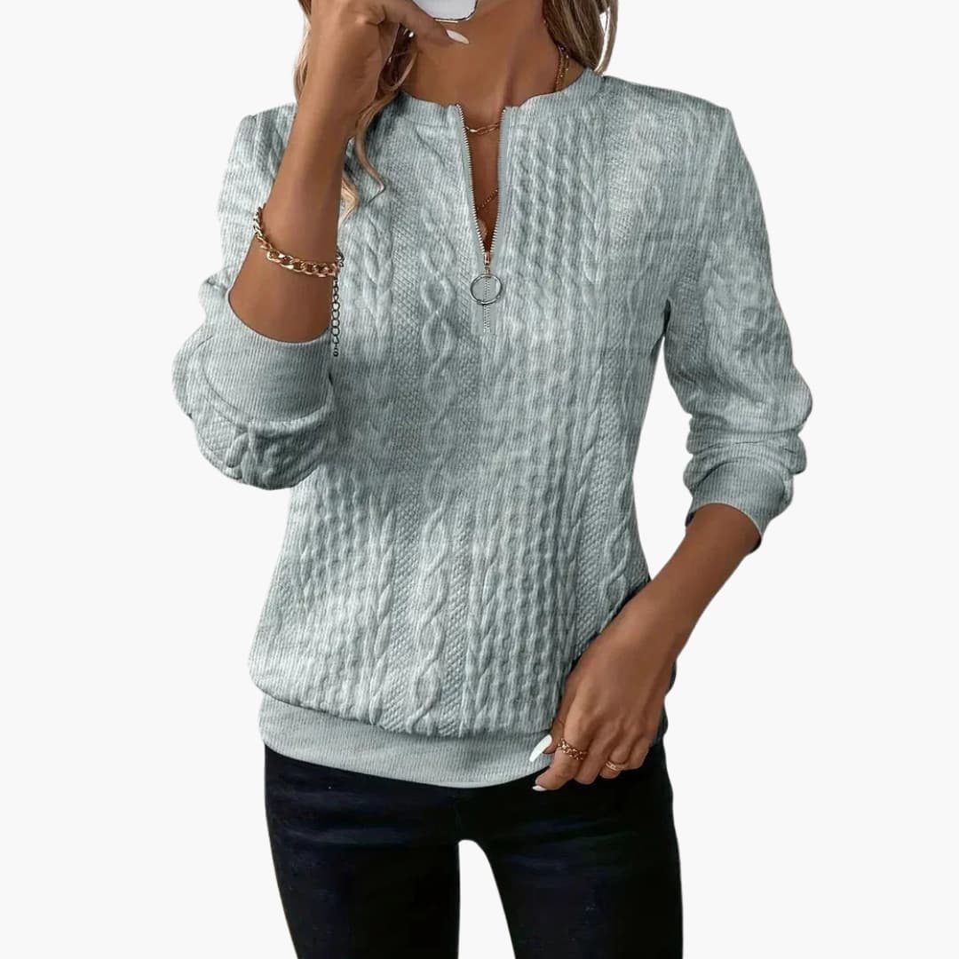 Pull femme à col zippé et maille torsadée