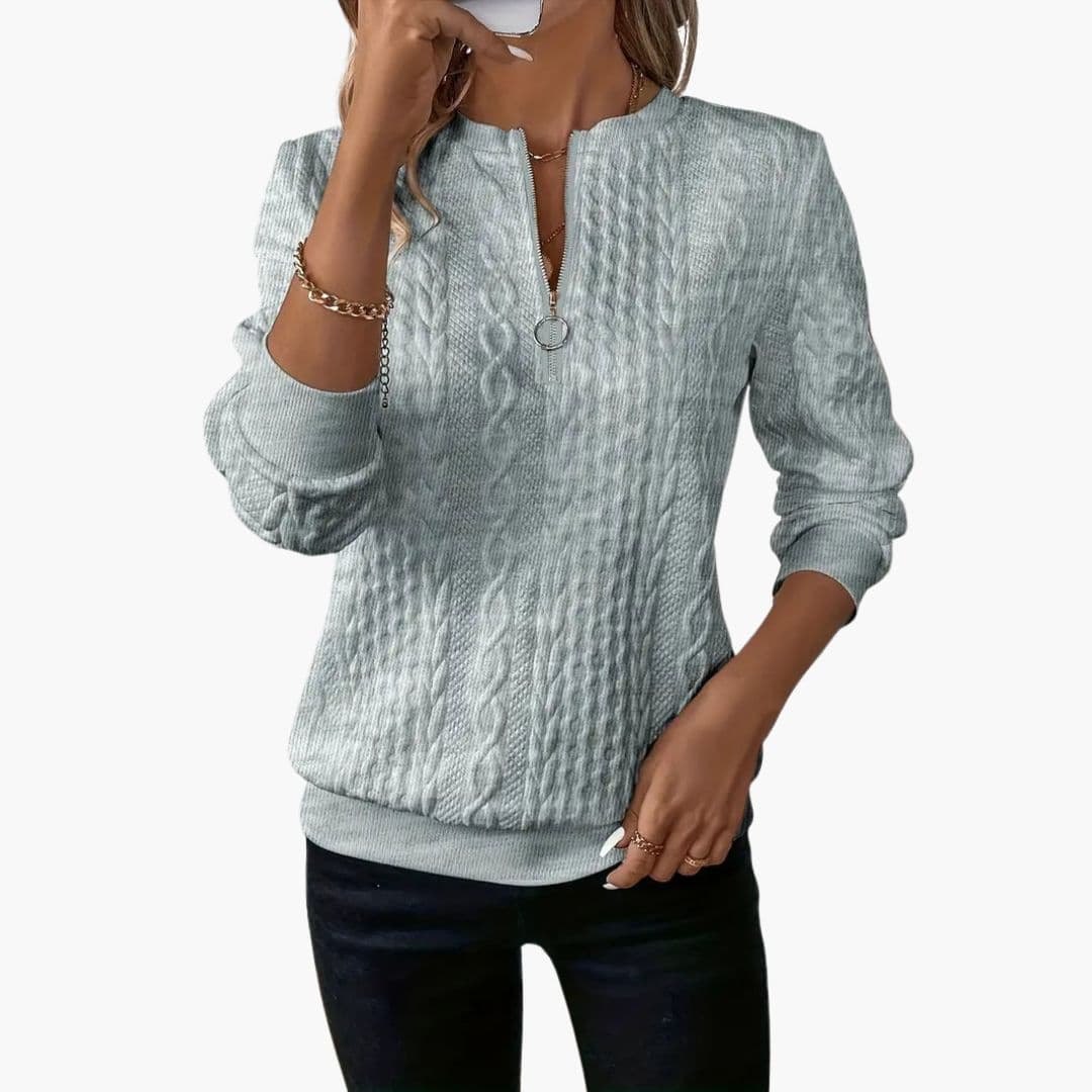 Pull femme torsadé avec col zippé et poignets côtelés