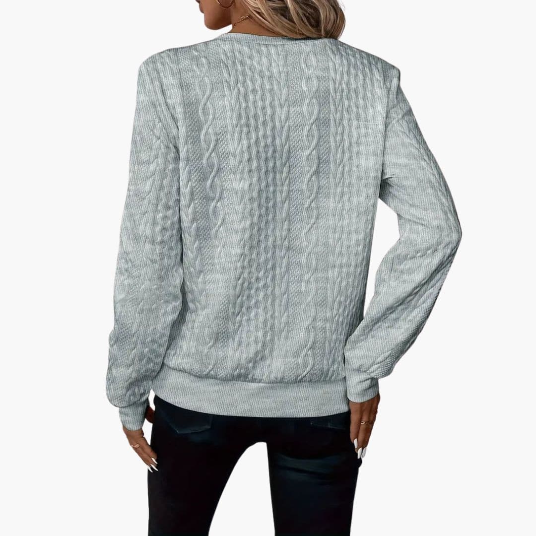 Pull femme torsadé avec col zippé et poignets côtelés