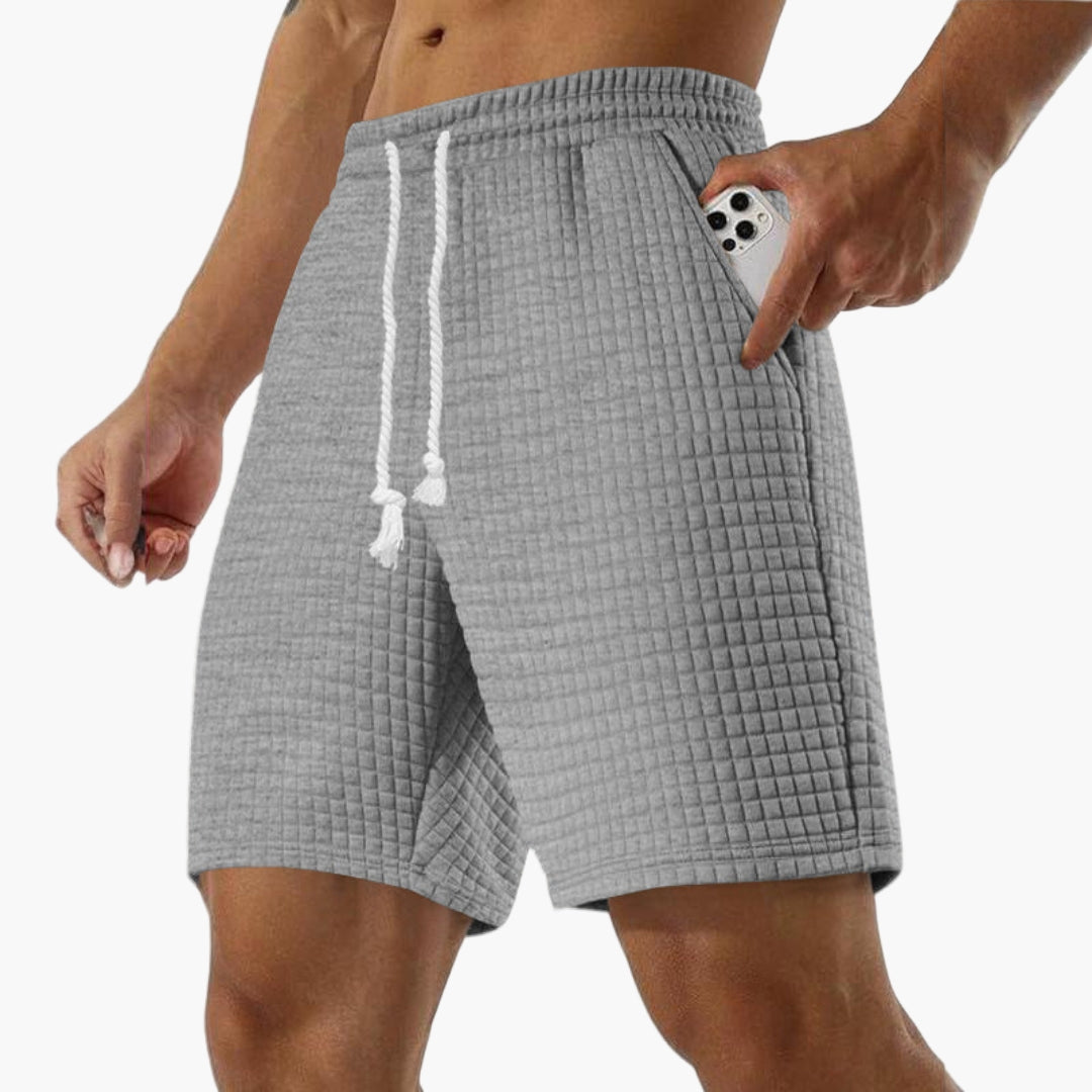 Kort sportshorts for menn med elastisk midje