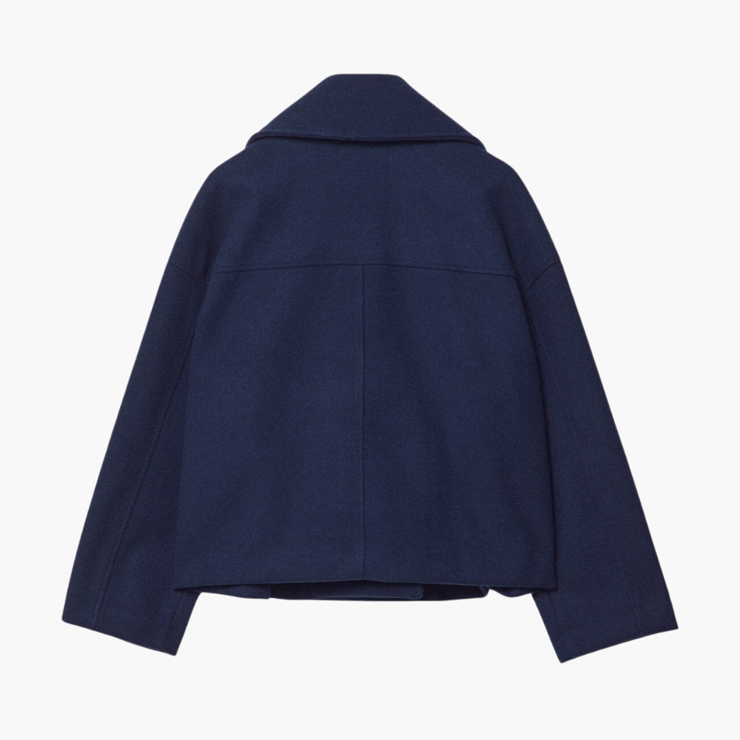 Kort damevest med krydset lukning