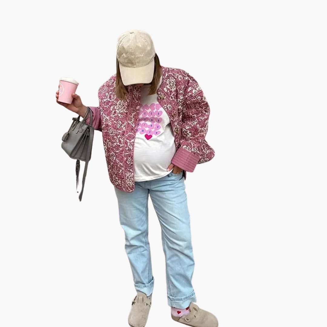 Damevest med blomsterprint og knaplukning