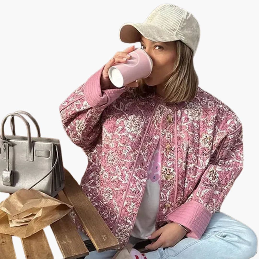 Damevest med blomsterprint og knaplukning